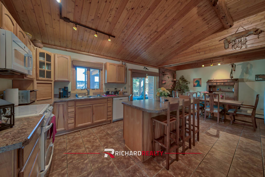 Photo 3 Property of the Week - 5 Driver Club | Kitchen with wood fireplace